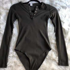 Body suit with front snaps